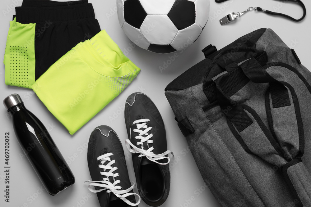 Gym bag and sports equipment on white background, flat lay Stock Photo