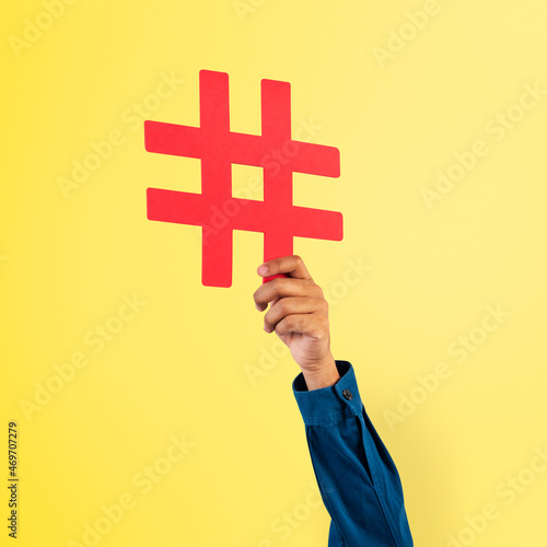 Fototapeta Naklejka Na Ścianę i Meble -  Hand holding hashtag  marketing trending concept