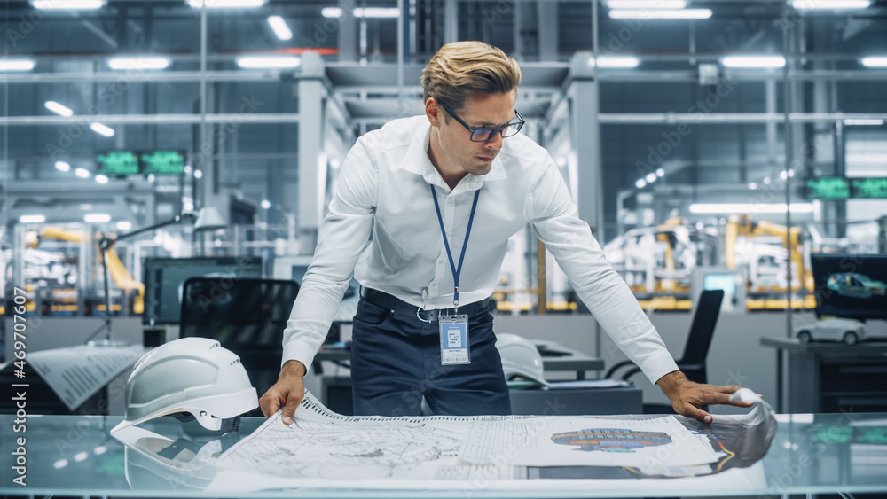 Professional Engineer in White Shirt Looking at a Technical Blueprint at Work in an Office at Car Assembly Plant. Industrial Specialist Working on Vehicle Parts in Technological Development Facility. - obrazy, fototapety, plakaty 