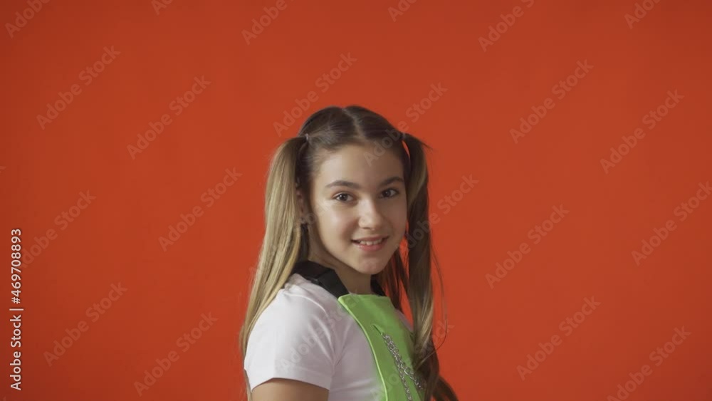 The young girl turns and smiles. Fun and positivity The young girl turns and smiles. Fun and positivity