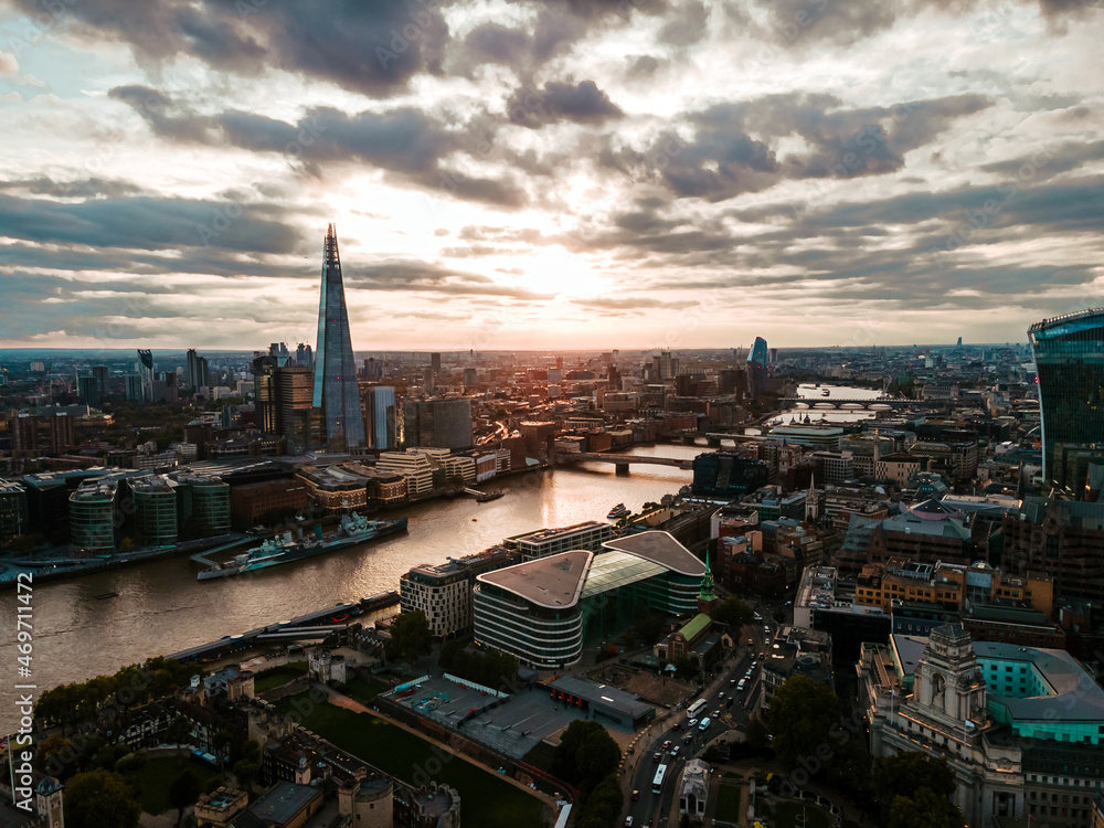 Aerial view to the Beautiful Tower Bridge and skyline of London, UK, during the sunset.
