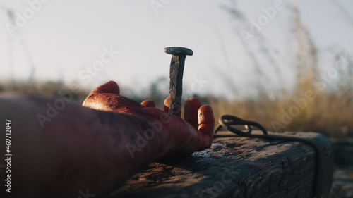 Photography Anonymous male executioner performing crucifixion
