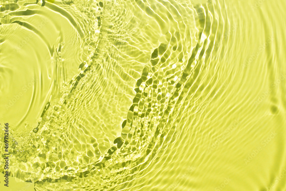 Fototapeta premium Aqua waves on a light green background. Light and shadows. Water spills on a light yellow background. Natural sunlight and shade. Minimal style.