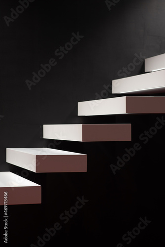 The original stairs coming out of the wall in white