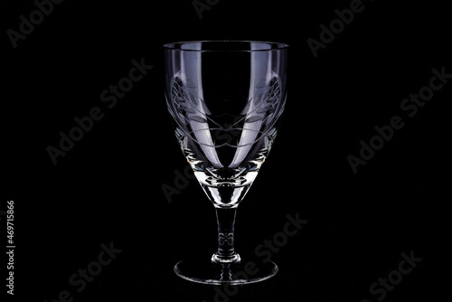 Empty wine glass on a black background, close up, isolated
