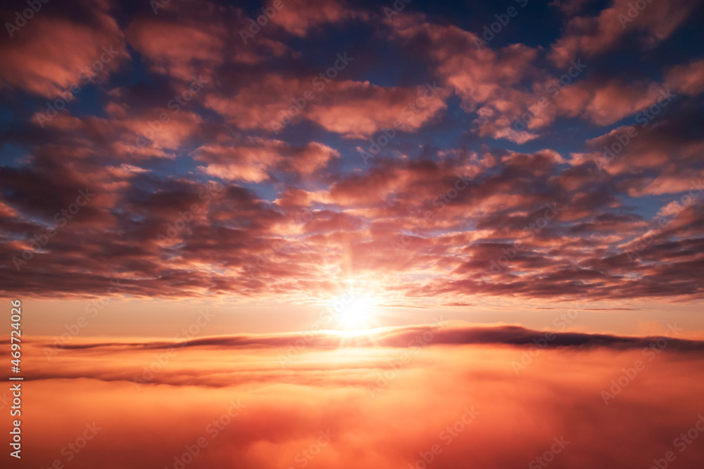 Morning shot of rising sun over the fog. Beautiful dream-like shot in the sky