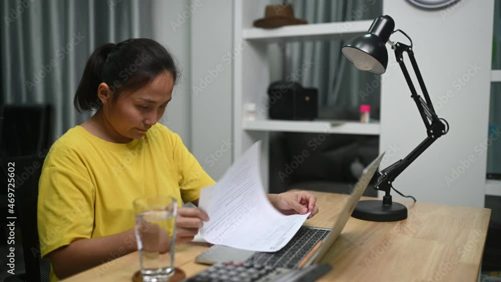 Asian woman working on laptop computer from home,New normal of lifestyle,