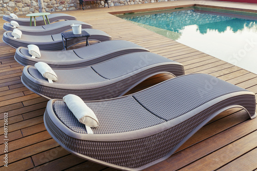 Relax on luxury sun loungers by the pool.