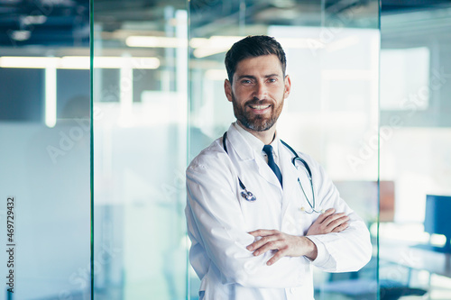 Wallpaper Mural Successful male doctor smiles and looks at the camera in the clinic Torontodigital.ca