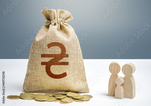 Obraz na plátně Ukrainian hryvnia money bag with money and family figurines