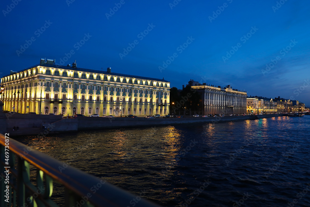 City in the Night Panorama of Brightly lit Buildings of the Embankment, Reflected in the Waters of Neva River Modern St. Petersburg at Night. Wallpaper Copy sSpace