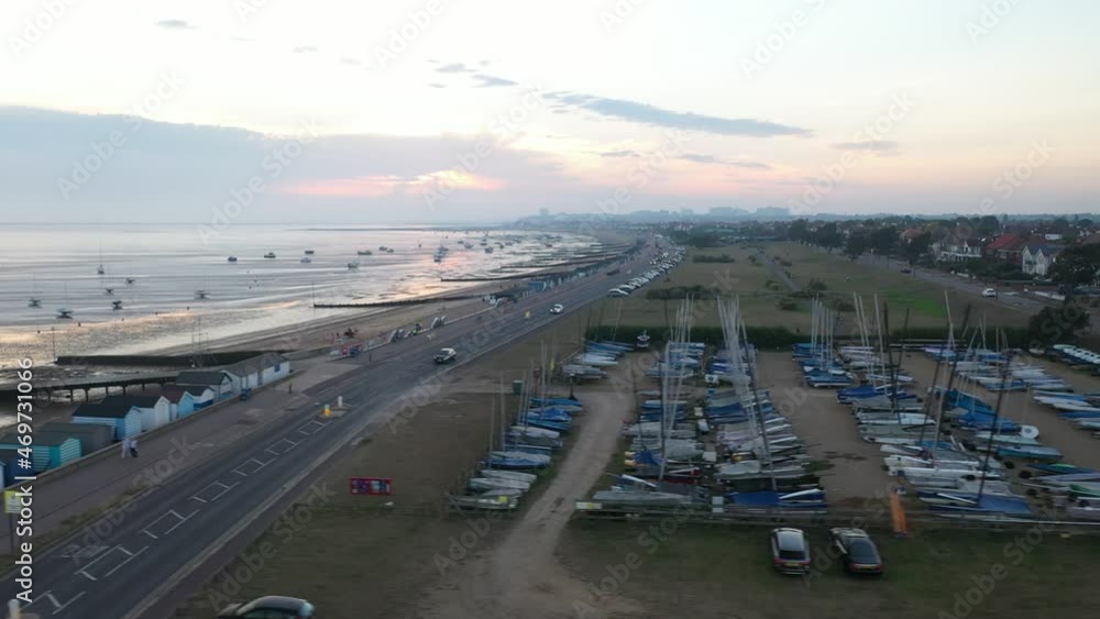 Yachts stored on bank, beach and coast at low tide after sunset Yachts stored on bank, beach and coast at low tide after sunset