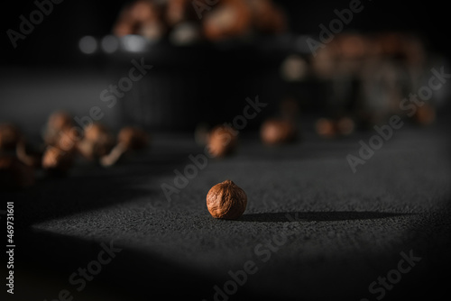 hazelnut without a shell on a dark background