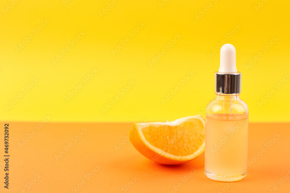 Pipette with orange essential oil over bottle and oranges. Natural medicine concept. Aromatherapy Pipette with orange essential oil over bottle and oranges. Natural medicine concept. Aromatherapy