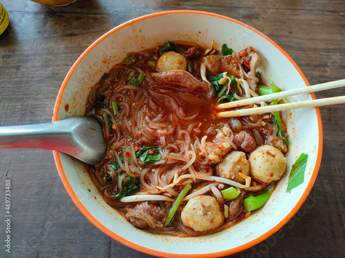 Thai boat noodles is Thailand's most famous noodles soup,Thai Boat noodles soup or Guay tiew reua ,Rice noodles thicken soup with stewed beef and beef ball. selective focus the beef ball