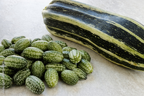 Cucamelon and zucchini vegetable on a table. photo