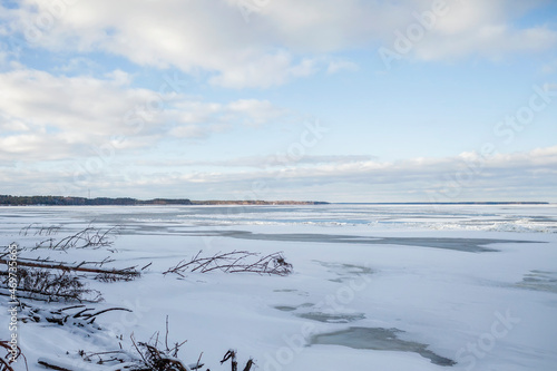 Gorgeous winter landscape of icy frozen lake like a desert  background with copy space  winter romantic  silence and wild nature