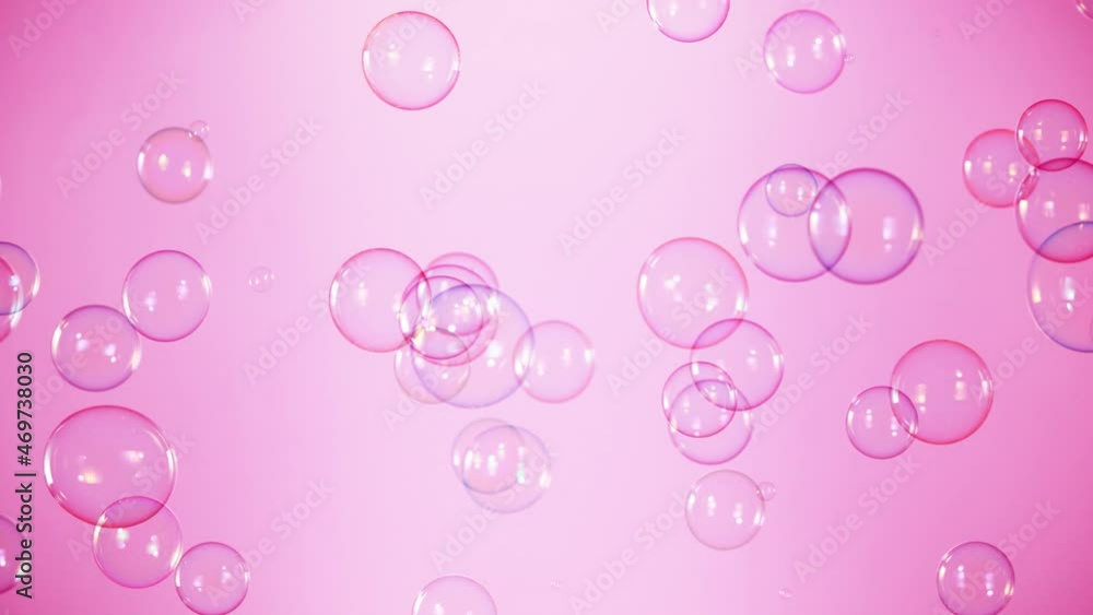 Super Slow Motion Shot of Flying Colorful Soap Bubbles on Pink Background at 1000 fps. Super Slow Motion Shot of Flying Colorful Soap Bubbles on Pink Background at 1000 fps.