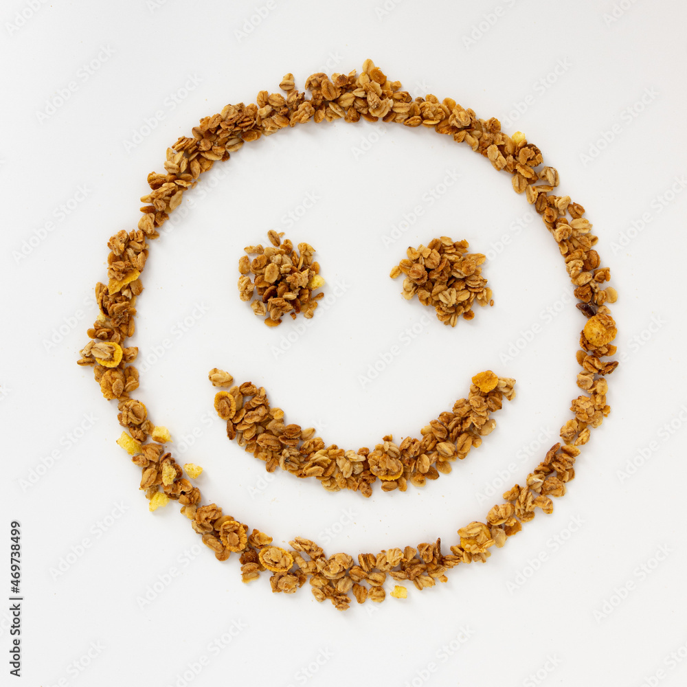 smiling face of cereal flakes on white background smiling face of cereal flakes on white background