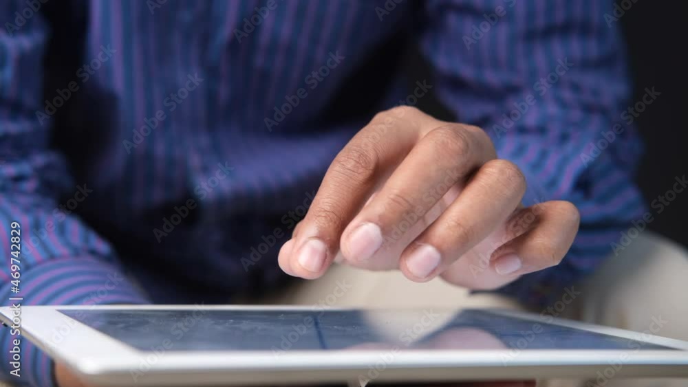 businessman using digital tablet while sited businessman using digital tablet while sited