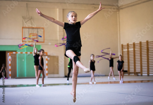 Girl gymnast who is going to jump in gym on training