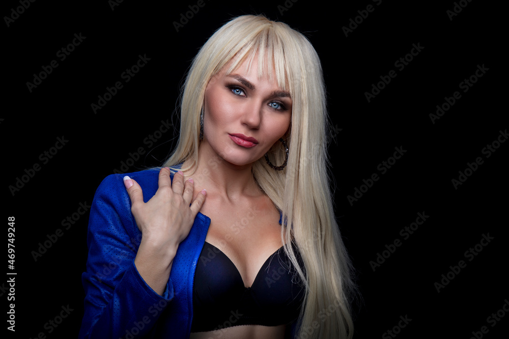 Portrait of beautiful young woman with long curly blonde hair Portrait of beautiful young woman with long curly blonde hair