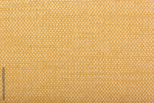 Factory fabric with brown and white threads interspersed. Close-up long and wide texture of natural fabric. Fabric texture of natural cotton or linen textile material.