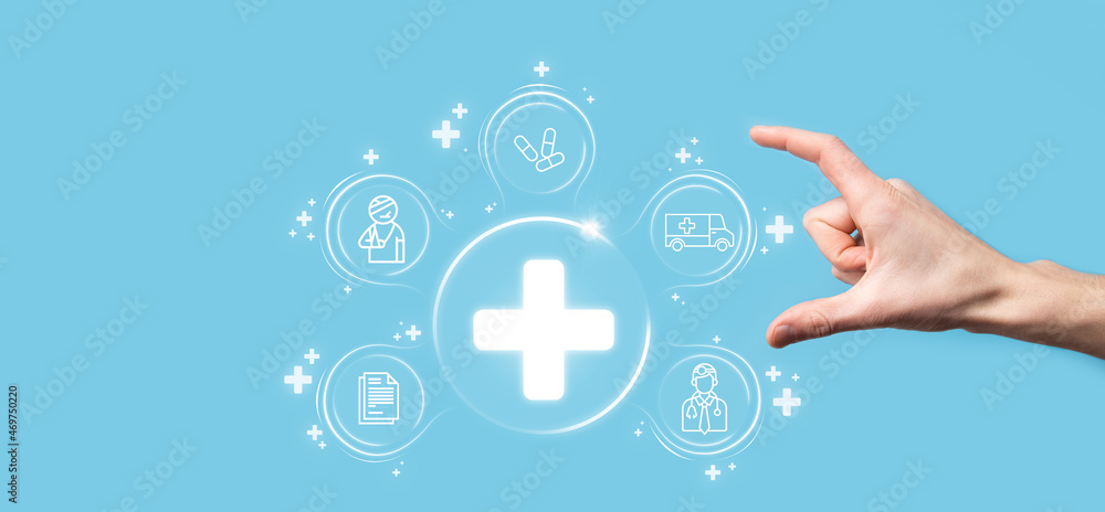 Businessman hold virtual plus medical network connection icons. Covid-19 pandemic develop people awareness and spread attention on their healthcare.Doctor,document,medicine,ambulance,patient icon. Businessman hold virtual plus medical network connection icons. Covid-19 pandemic develop people awareness and spread attention on their healthcare.Doctor,document,medicine,ambulance,patient icon.
