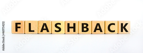 Flashback symbol. The concept word Flashback on wooden cubes. Beautiful white table, white background. Business and flashback concept. Copy space. photo
