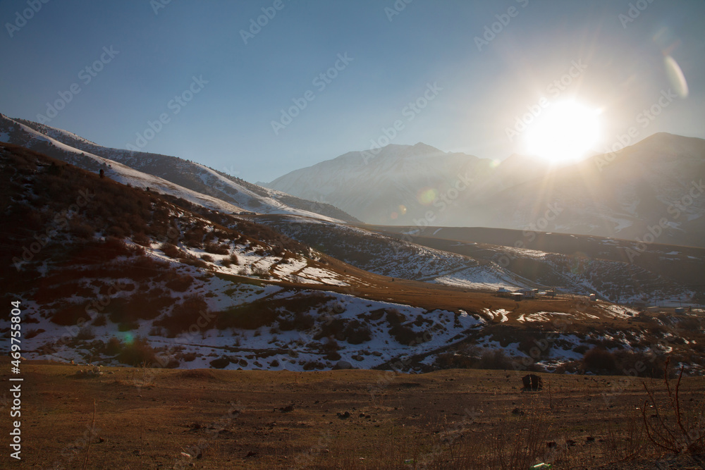 Beautiful sunset in the mountains evening view of the Tien Shan mountain range, Kyrgyzstan Beautiful sunset in the mountains evening view of the Tien Shan mountain range, Kyrgyzstan
