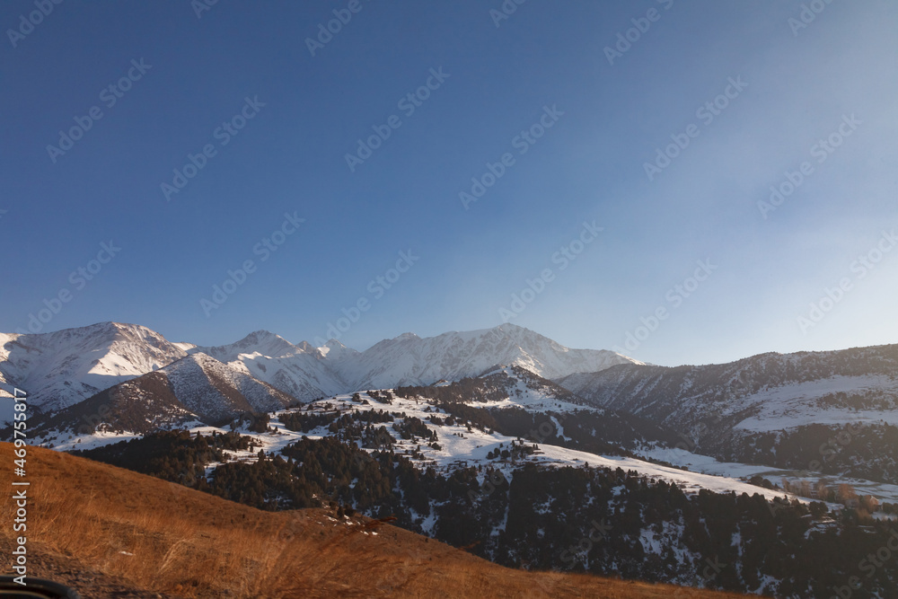 Fototapeta premium Panorama of the mountains: The Tien Shan Mountains in the evening
