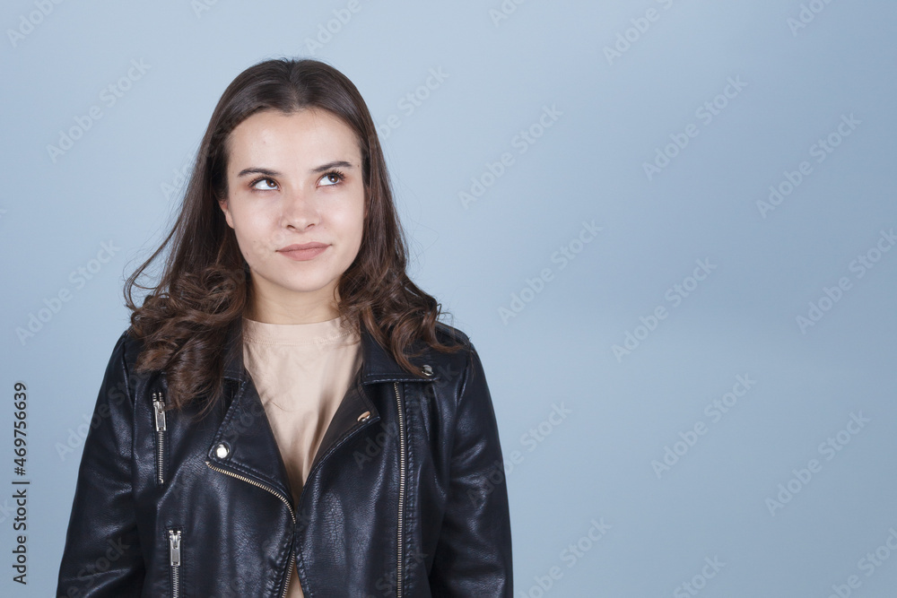 the young lady in the dark jacket is angry. the young lady in the dark jacket is angry.