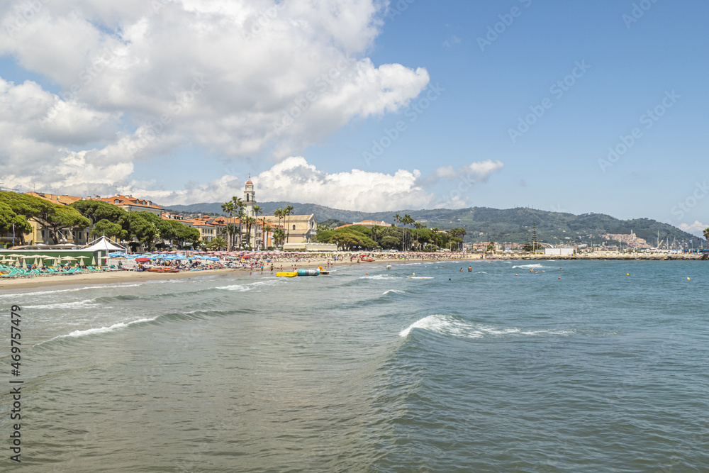 The beach of Diano Marina with a beautiful church in background