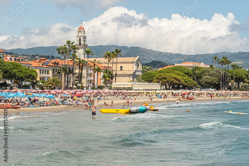 The beach of Diano Marina with a beautiful church in background
