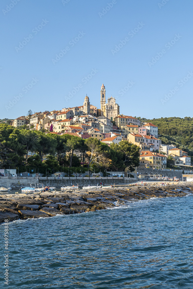 Cervo beach with its characteristic rocks and the beautiful town in the background