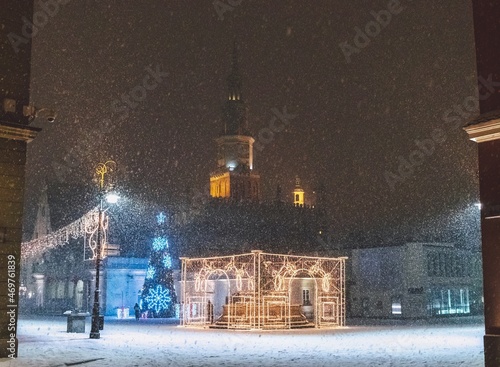Late-night snowing at the Old Town square in Poznan, Poland