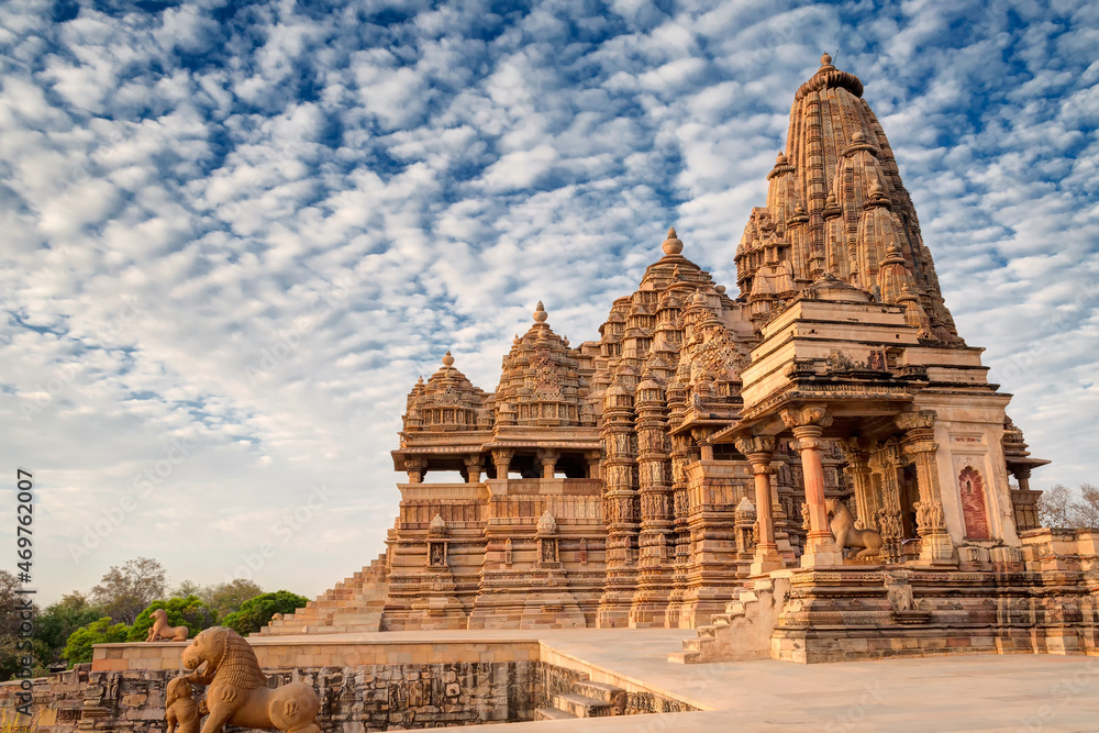 Beautiful image of Kandariya Mahadeva temple, Khajuraho, Madhyapradesh, India with blue sky and fluffy clouds in the background, It is worldwide famous ancient temples, UNESCO world heritage site.