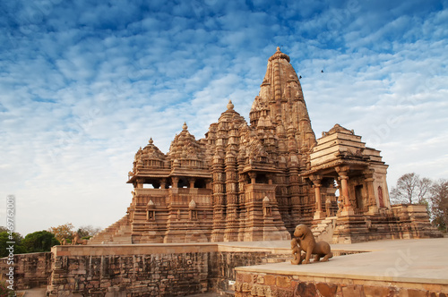 Kandariya Mahadeva Temple, dedicated to Shiva, Western Temples of Khajuraho under cloudy sky, Madya Pradesh, India. Khajuraho is UNESCO World heritage site and is popular tourist destination. photo