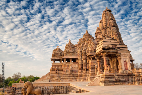 Beautiful image of Kandariya Mahadeva temple  Khajuraho  Madhyapradesh  India with blue sky and fluffy clouds in the background  It is worldwide famous ancient temples  UNESCO world heritage site.