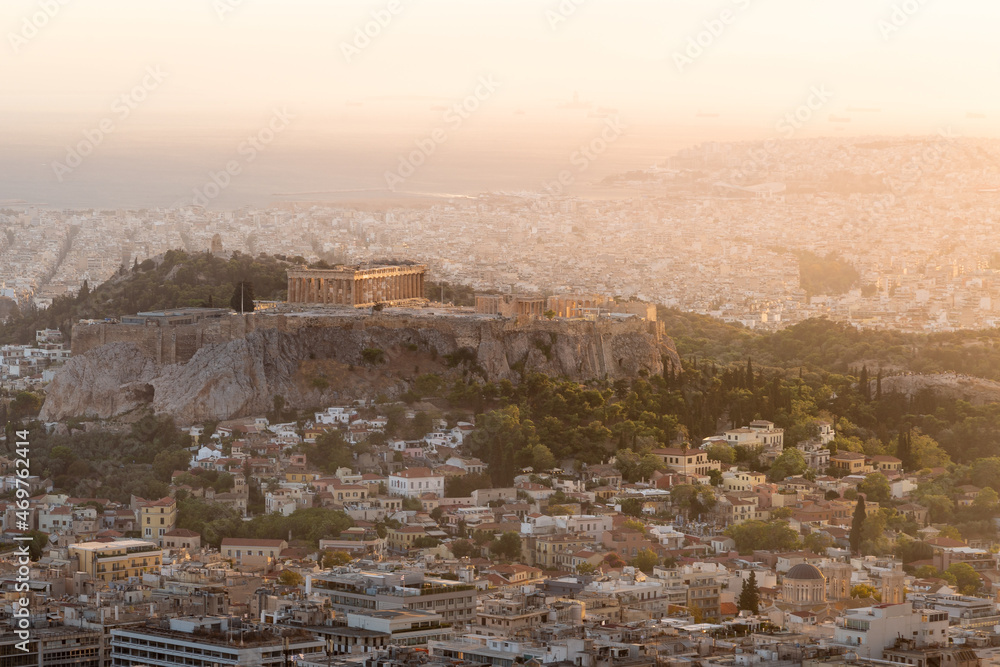 Sunset cityscape of Athens, Greece featuring Acropolis with ancient Greek temple Parthenon on a hill