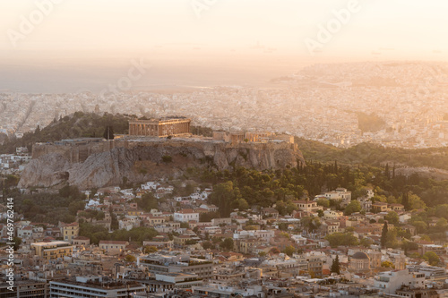 Sunset cityscape of Athens, Greece featuring Acropolis with ancient Greek temple Parthenon on a hill