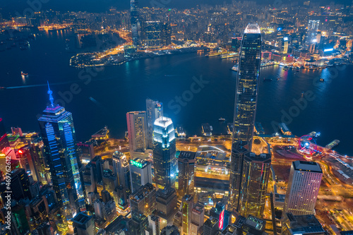 Aerial shot a Victoria Harbor of Hong Kong at night time.