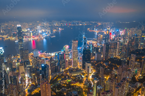Aerial shot a Thousand of skyscraper on two side of Victoria Harbour of Hong Kong. View from the Peak at night. © Timelapse4K