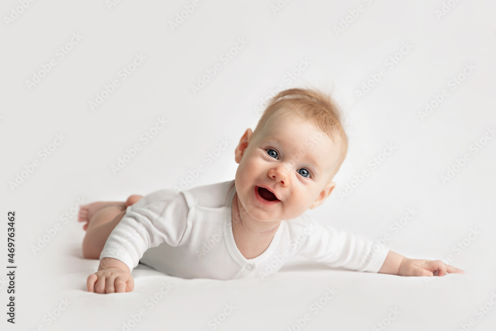 smiling baby in white clothes on light background smiling baby in white clothes on light background