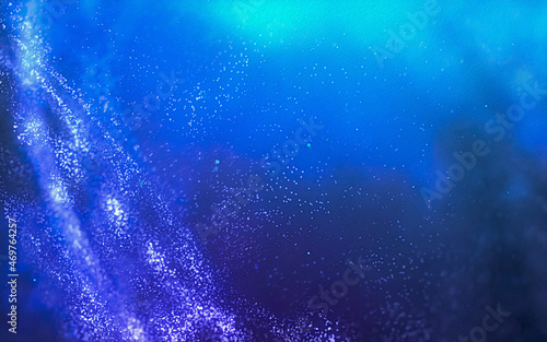 Abstract background with particles mesh and glowing shining bokeh of a variety of lenses.