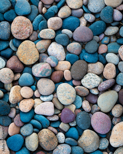 Colorful smooth stones on the shore of Lake Superior in Michigan photo