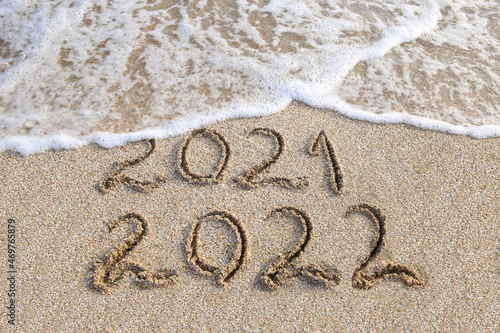 Obraz na plátně 2021, 2022 years written on sandy beach sea