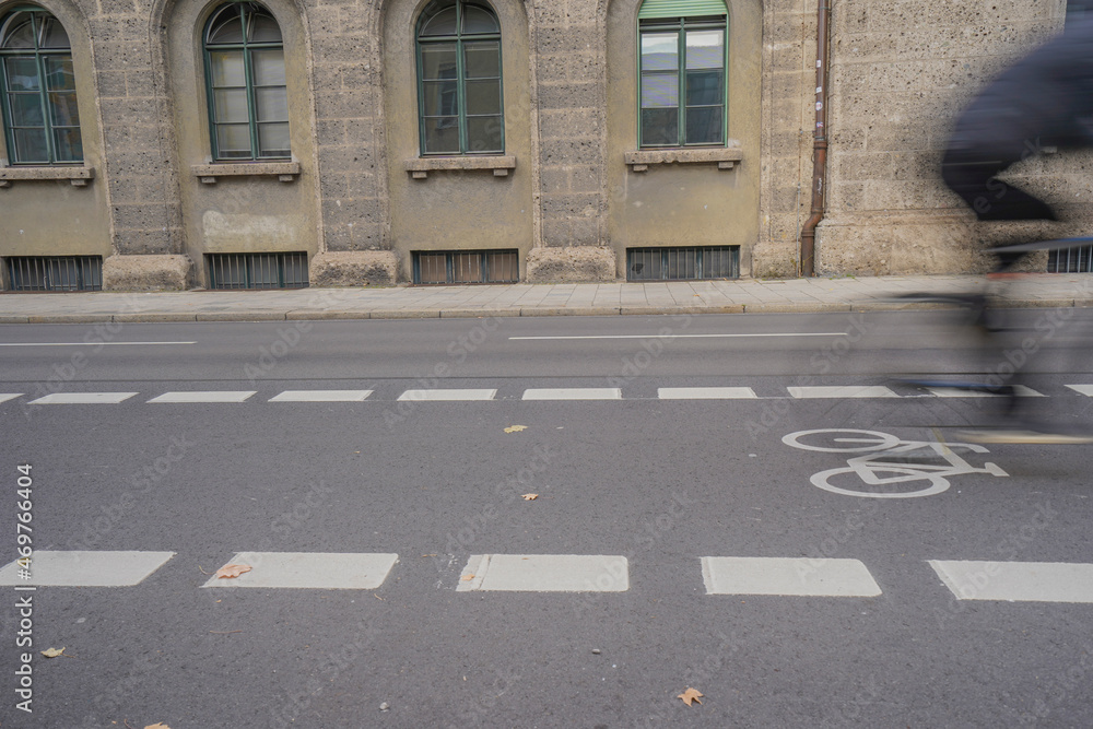 custom made wallpaper toronto digitalBicycle lane with white symbol marking on an asphalt city street with blurred cyclist