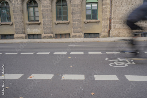 Wallpaper Mural Bicycle lane with white symbol marking on an asphalt city street with blurred cyclist Torontodigital.ca