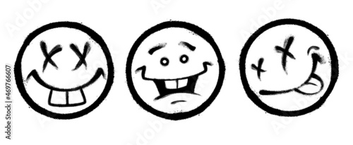 Three graffiti emoticons. Smiling face painted spray paint. Vector illustration on white background